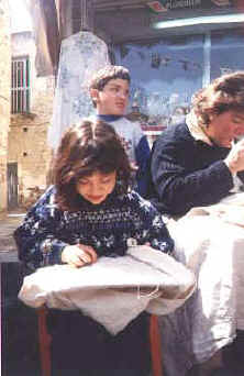 children lacemaking in the sunshine at Lefkara in Cyprus.jpg (26974 bytes)